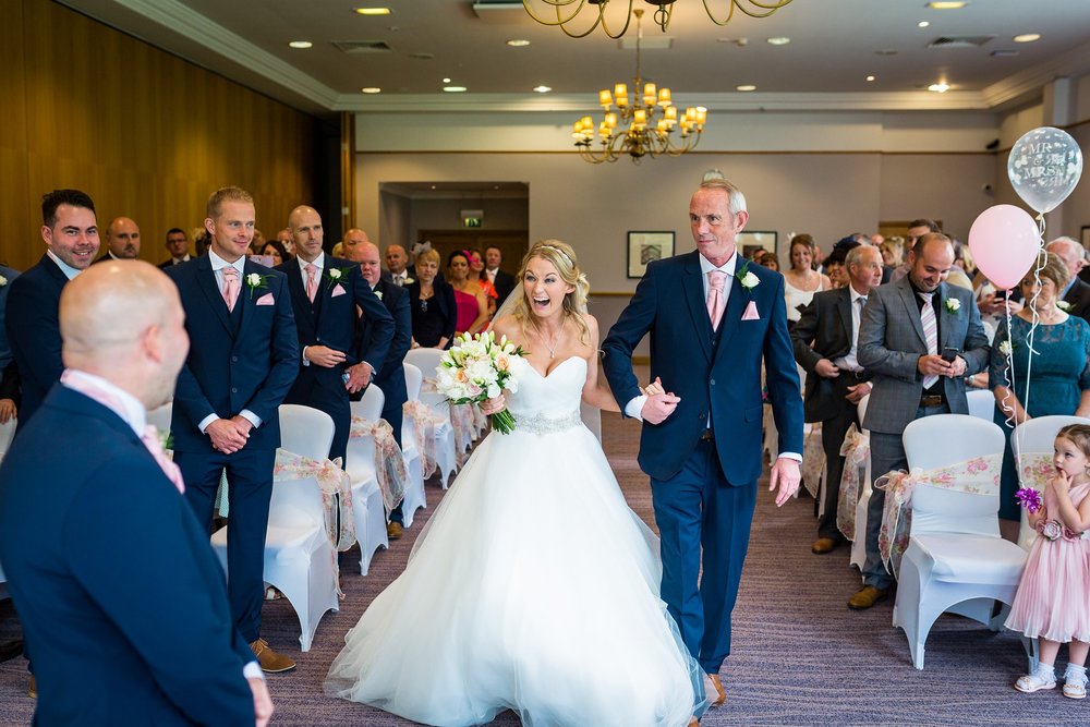 photo of bride walking down the aisle