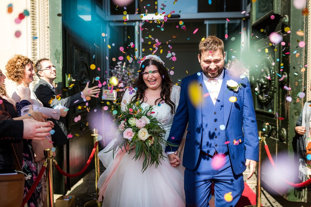 couple walking through confetti